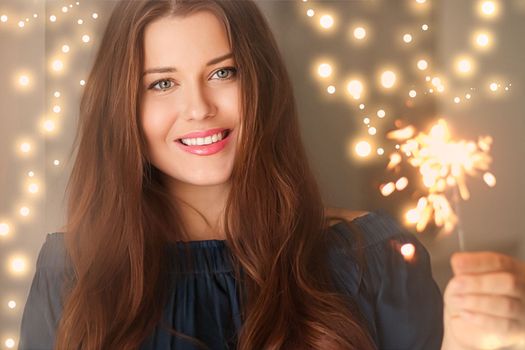 Holiday magic, Christmas and New Year celebration, happy woman with sparklers, portrait