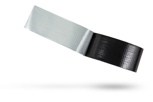 Roll of black adhesive tape isolated on white background. Reinforced black duct tape falls, casting a shadow. Unwound roll of electrical tape