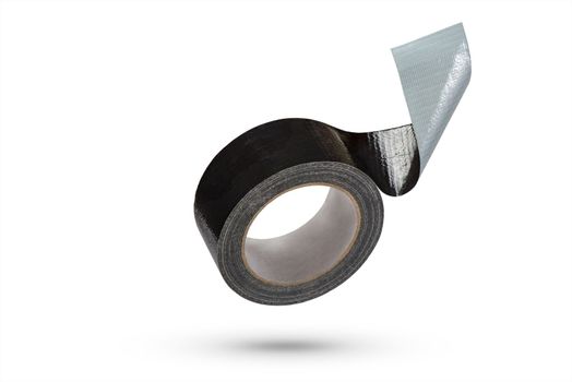 Roll of black adhesive tape isolated on white background. Reinforced black duct tape falls, casting a shadow. Unwound roll of electrical tape