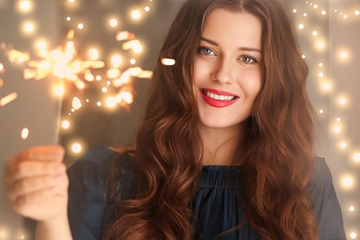 Holiday magic, Christmas and New Year celebration, happy woman with sparklers, portrait