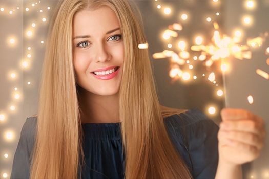 Holiday magic, Christmas and New Year celebration, happy woman with sparklers, portrait