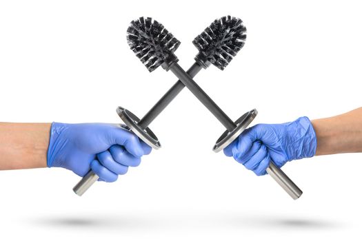 Black toilet brush isolated on white. Close-up of toilet brushes in hands crossed like swords. Metal brush for the toilet on a white background