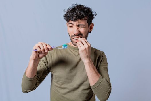 People holding toothbrush with gum pain. Man holding toothbrush with gum pain, People holding toothbrush with gum problem isolated, Person with gingivitis holding toothbrush