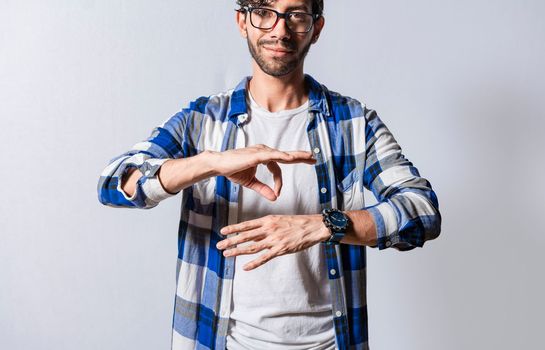 Young man gesturing in sign language, People who speak in sign language. Manual gestures of people with hearing problems, Person speaking in sign language isolated