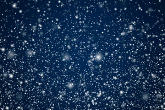 Winter holidays and wintertime background, white snow falling on dark blue backdrop, snowflakes bokeh and snowfall particles as abstract snowing scene for Christmas and snowy holiday design, copyspace