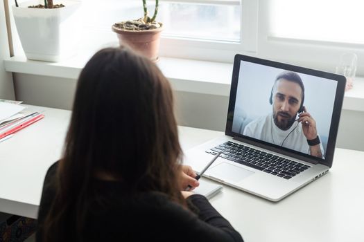 Latin hispanic girl college student taking online training class on laptop computer sitting at university table. Virtual education webinar. High quality photo