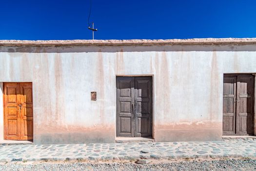 a house made of clay and red bricks in the countryside of Aregenina in the Andes mountains. 