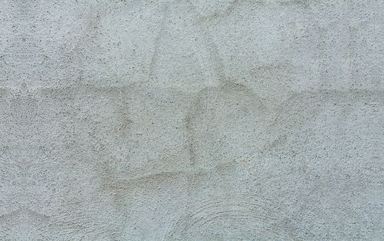 Texture of a gray wall. Cracked gray wall background. Details of a textured gray wall, Granite textured gray wall background. Gray wall of house with texture