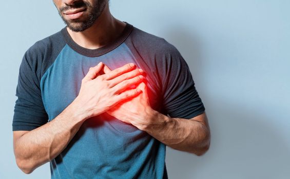 People with chest pain isolated, young man with tachycardia, man with heart pain on isolated background, young man with heart pain. Concept of people with heart problems