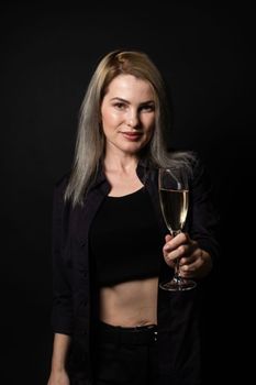 woman with a glass on a black background.