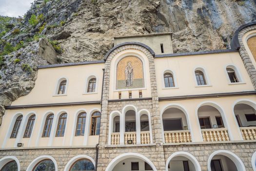 Monastery of Ostrog, Serbian Orthodox Church situated against a vertical background, high up in the large rock of Ostroska Greda, Montenegro. Dedicated to Saint Basil of Ostrog.