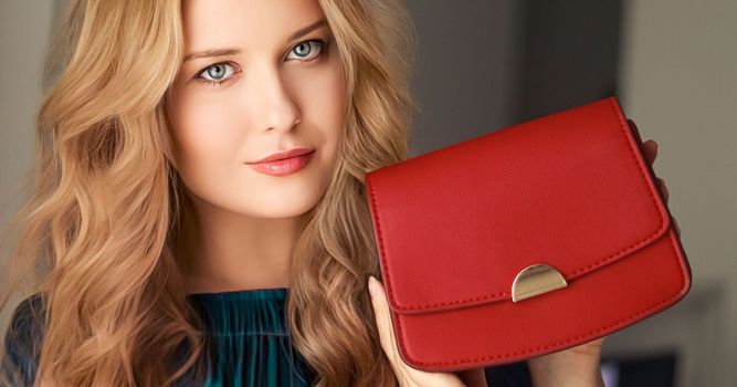 Fashion and accessories, happy beautiful woman holding small red handbag with golden details as stylish accessory and luxury shopping concept