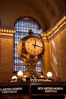 Image of Clock in golden light inside Grand Central Station New York City