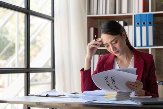 Young Business Asian women are stressed while working on laptop, Tired asian businesswoman with headache at office, feeling sick at work copy space in workplace an home office...