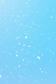 Winter holidays and wintertime background, white snow falling on blue backdrop, snowflakes bokeh and snowfall particles as abstract snowing scene for Christmas and snowy holiday design. High quality 4k footage