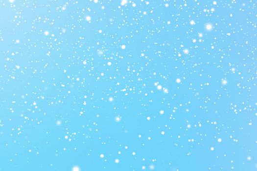 Winter holidays and wintertime background, white snow falling on blue backdrop, snowflakes bokeh and snowfall particles as abstract snowing scene for Christmas and snowy holiday design. High quality 4k footage