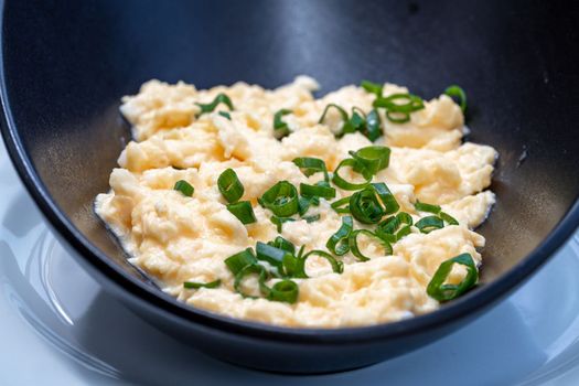 scrambled eggs with fresh green onions.