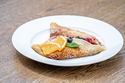pancake with fruit and marmalade for breakfast and as dessert.