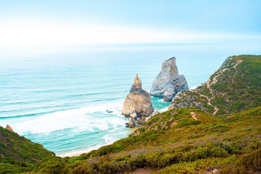 View of a hidden Praia Da Ursa Beach in summer day light near Cabo Da Roca on Atlantic coast, Portugal