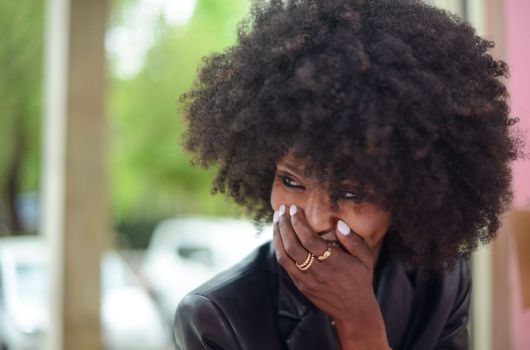 Young attractive African woman with happy cheerful smile having fun