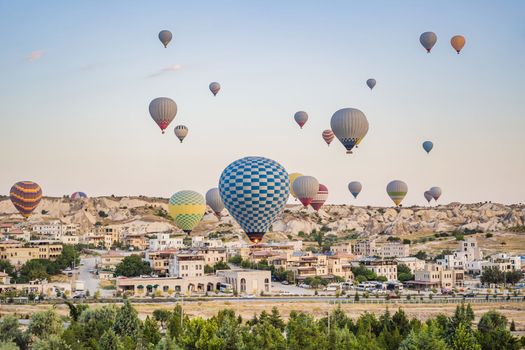 Colorful hot air balloon flying over Cappadocia, Turkey.