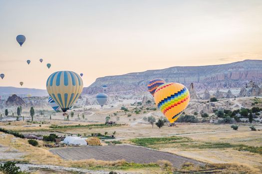 Colorful hot air balloon flying over Cappadocia, Turkey.