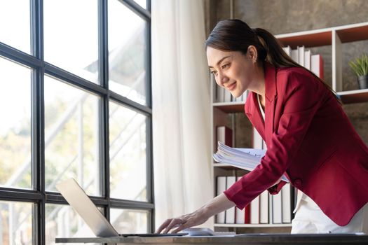 Business Documents, Auditor businesswoman checking searching document legal prepare paperwork or report for analysis TAX time,accountant Documents data contract partner deal in workplace office..