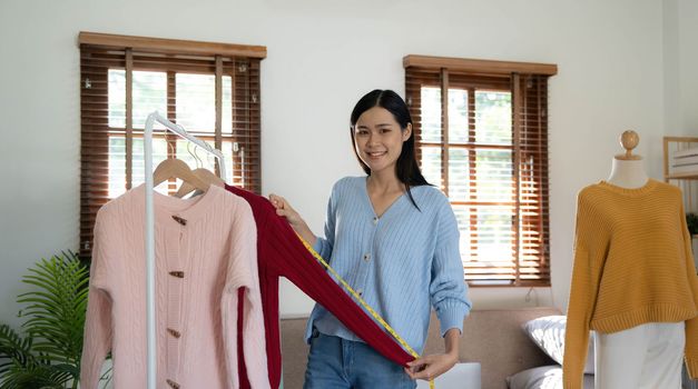 Startup small business entrepreneur SME, asian woman packing box. Portrait of young Asian small business owner in home office, online sell marketing delivery