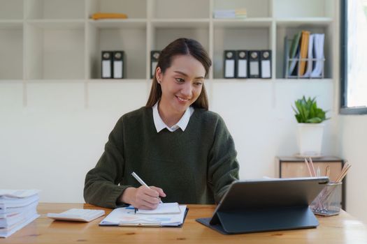 Asian Business woman making prepare presentation or important email of financial. Business Accountant working in home office