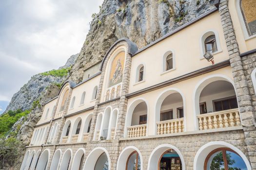 Monastery of Ostrog, Serbian Orthodox Church situated against a vertical background, high up in the large rock of Ostroska Greda, Montenegro. Dedicated to Saint Basil of Ostrog.