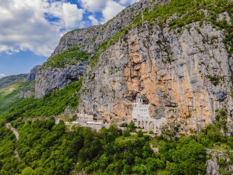 Monastery of Ostrog, Serbian Orthodox Church situated against a vertical background, high up in the large rock of Ostroska Greda, Montenegro. Dedicated to Saint Basil of Ostrog.