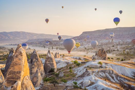 Colorful hot air balloon flying over Cappadocia, Turkey.