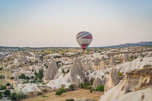 Colorful hot air balloon flying over Cappadocia, Turkey.