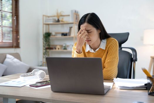 asian woman thinking hard concerned about online problem solution looking at laptop screen, worried serious asian businesswoman focused on solving difficult work computer task..