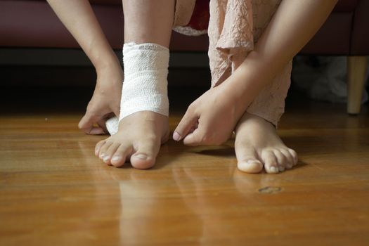 Woman with bandaged foot close up ,