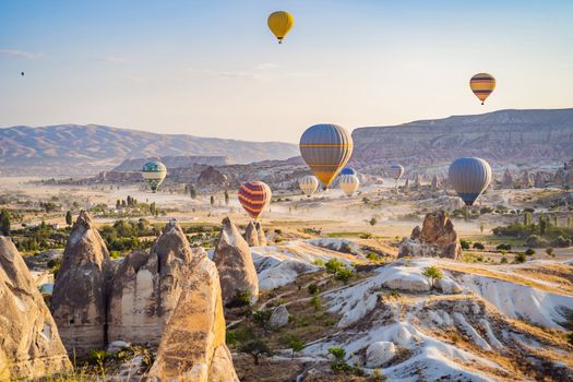 Colorful hot air balloon flying over Cappadocia, Turkey.