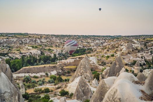 Colorful hot air balloon flying over Cappadocia, Turkey.