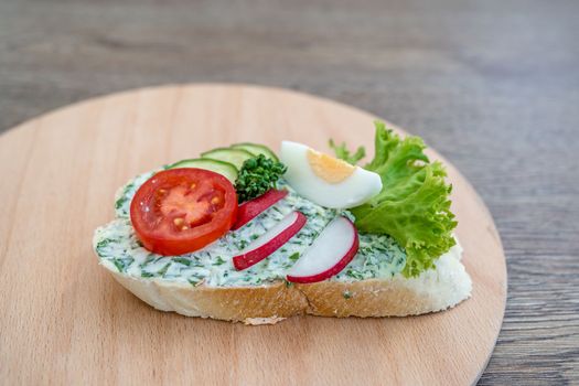 bread with salad, vegetables and egg.