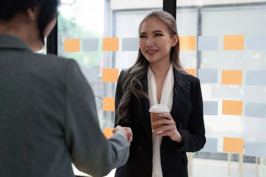 Business partnership meeting concept. Image businessmans handshake. Successful businessmen handshaking after good deal. Group support concept.