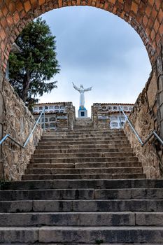 Statue of Christ in a cemetery in the city of Yungay under Mount Huascaran in Peru. 