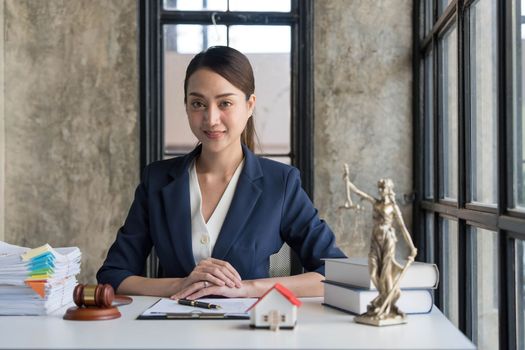Business woman or lawyers working on wooden desk in office. Law, legal services, advice,Judge auction and real estate concept...
