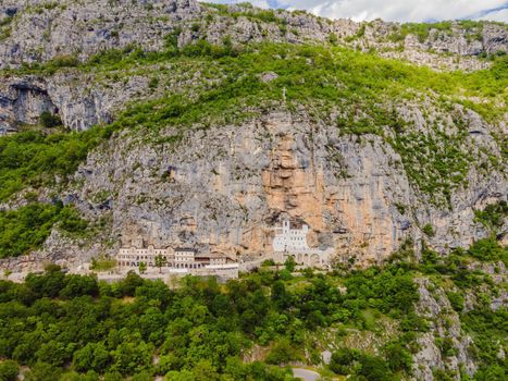 Monastery of Ostrog, Serbian Orthodox Church situated against a vertical background, high up in the large rock of Ostroska Greda, Montenegro. Dedicated to Saint Basil of Ostrog.