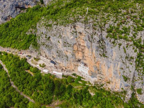Monastery of Ostrog, Serbian Orthodox Church situated against a vertical background, high up in the large rock of Ostroska Greda, Montenegro. Dedicated to Saint Basil of Ostrog.
