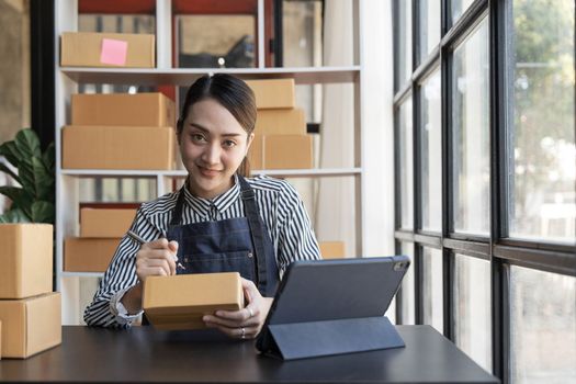 Starting small businesses SME owners female entrepreneurs Ordering numbers, receiving and reviewing online orders to prepare to pack the boxes, sell to customers, online sme business ideas...