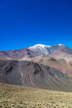 magnificent panorama of the South American Andes with snow-covered hills.