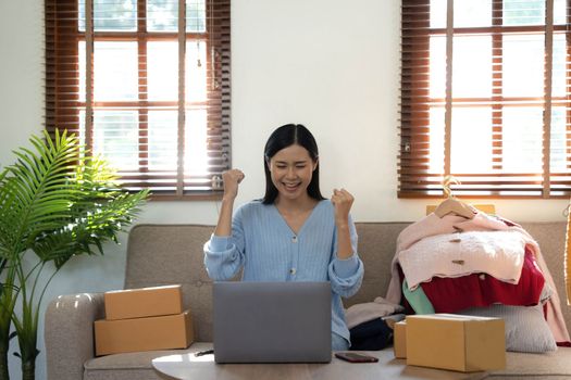 Startup small business entrepreneur SME, asian woman packing box. Portrait of young Asian small business owner in home office, online sell marketing delivery
