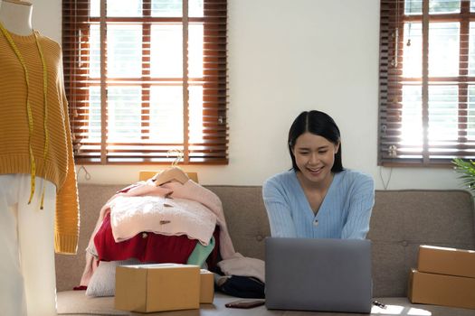 Startup small business entrepreneur SME, asian woman packing box. Portrait of young Asian small business owner in home office, online sell marketing delivery