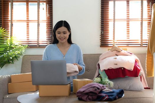 Startup small business entrepreneur SME, asian woman packing box. Portrait of young Asian small business owner in home office, online sell marketing delivery