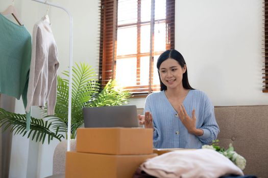 Startup small business entrepreneur SME, asian woman packing box. Portrait of young Asian small business owner in home office, online sell marketing delivery