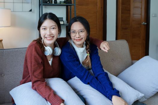 lgbtq, lgbt concept, homosexuality, portrait of two asian women enjoying together and showing love for each other while using tablet.